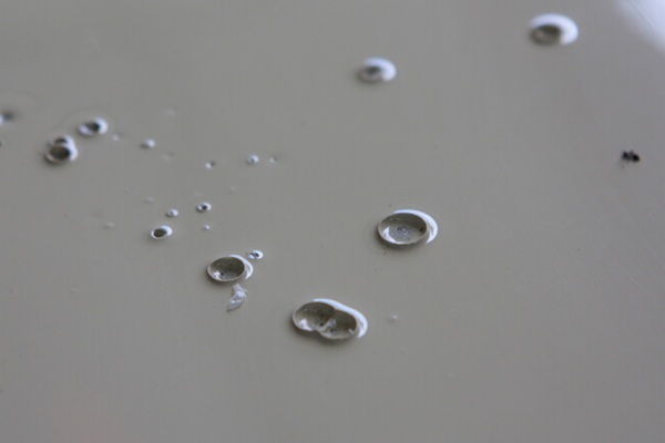 Bubble defects appear as small holes or voids on the surface